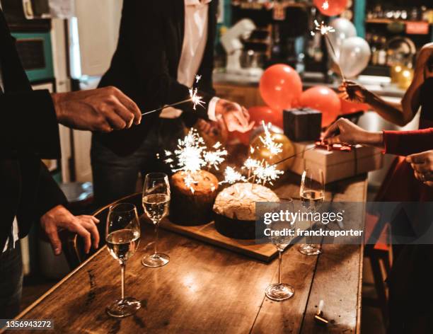 new year celebration with champagne - panettone stock pictures, royalty-free photos & images