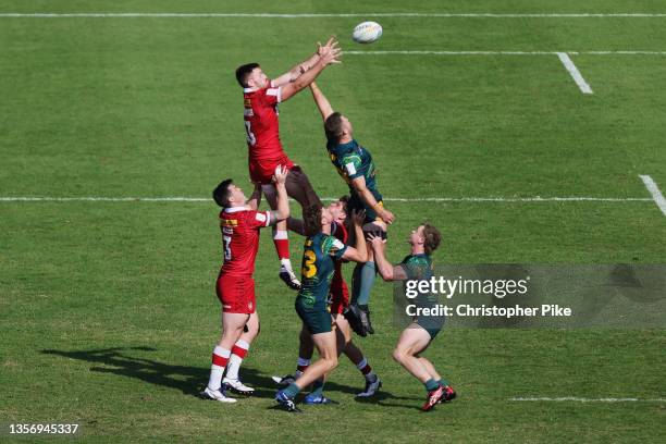 Jarvis Dashkewytch of Canada and Nick Malouf Of Australia compete for the ball during the match between Australia and Canada on Day One of the HSBC...