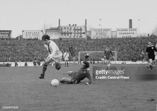 Peter Taylor, Winger for Crystal Palace Football Club jumps to clear the sliding tackle challenge from Ron Harris of Chelsea during their FA Cup...