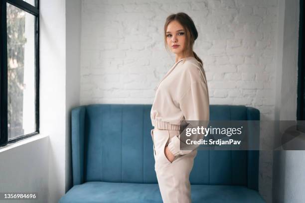 portrait of modern and urban caucasian young woman - track suit stock pictures, royalty-free photos & images