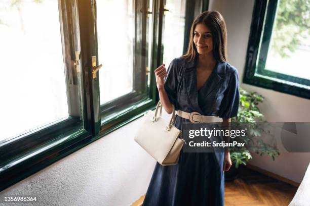 modern and elegant young businesswoman at restaurant - belt imagens e fotografias de stock