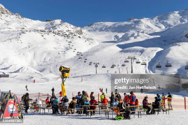 Skiers sit in front of the Idalp Restaurant at the Ischgl ski resort during the fourth wave of the coronavirus pandemic on December 03, 2021 in...