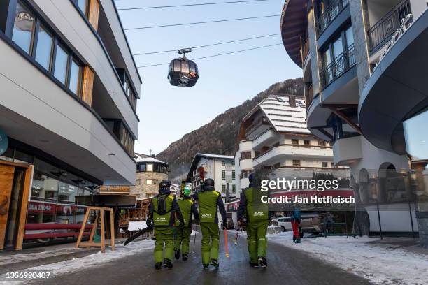 Skiers walk through Ischgl during the fourth wave of the coronavirus pandemic on December 03, 2021 in Ischgl, Austria. Ski lifts at Ischgl opened...