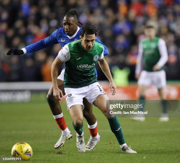 Joe Newell of Hibernian vies with Joe Aribo of Rangers during the Cinch Scottish Premiership match between Hibernian FC and Rangers FC at on December...