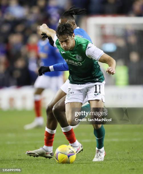 Joe Newell of Hibernian vies with Joe Aribo of Rangers during the Cinch Scottish Premiership match between Hibernian FC and Rangers FC at on December...