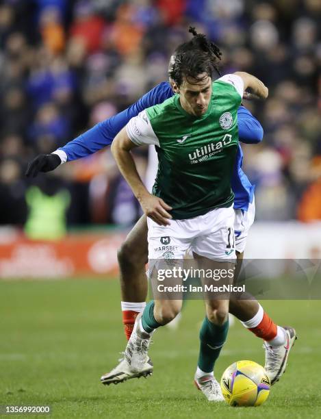 Joe Newell of Hibernian vies with Joe Aribo of Rangers during the Cinch Scottish Premiership match between Hibernian FC and Rangers FC at on December...