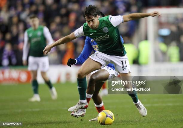 Joe Newell of Hibernian vies with Joe Aribo of Rangers during the Cinch Scottish Premiership match between Hibernian FC and Rangers FC at on December...