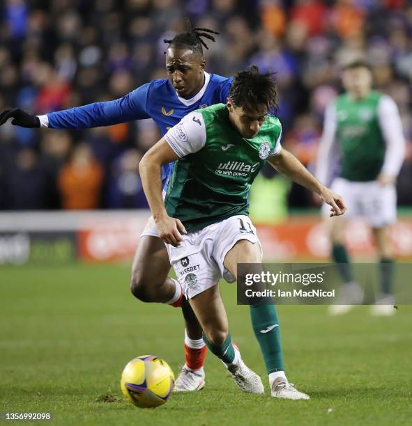 Joe Newell of Hibernian vies with Joe Aribo of Rangers during the Cinch Scottish Premiership match between Hibernian FC and Rangers FC at on December...