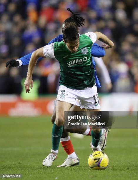 Joe Newell of Hibernian vies with Joe Aribo of Rangers during the Cinch Scottish Premiership match between Hibernian FC and Rangers FC at on December...