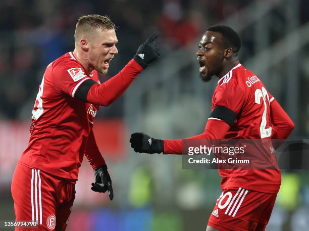 Rouwen Hennings of Duesseldorf celebrates scoring his team's first goal with Khaled Narey during the Second Bundesliga match between SV Darmstadt 98...