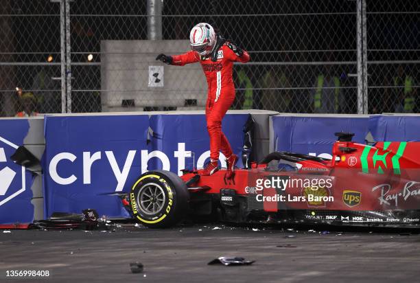 Charles Leclerc of Monaco and Ferrari looks at his car after crashing during practice ahead of the F1 Grand Prix of Saudi Arabia at Jeddah Corniche...