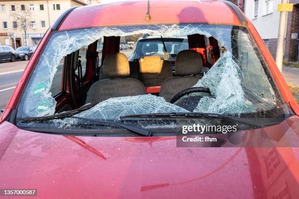 accident car with broken windshield - broken windshield stock-fotos und bilder