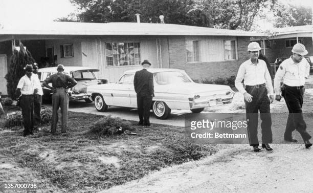 View of police officers outside the home of assassinated Civil Rights leader Medgar Evers, field secretary for the NAACP. Evers was shot to death by...