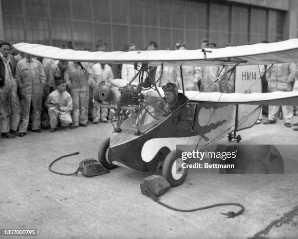 With Clyde Pangborn, noted aviator, at the controls, the "Flea Plane" which is designed to make the middleman air conscious, took to the air for the...