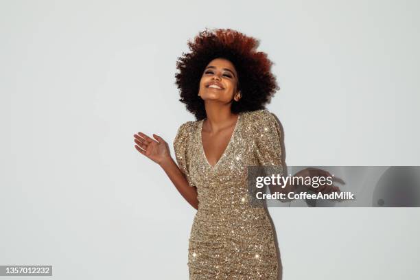 beautiful afro woman with perfect make-up wearing shiny dress - below knees stock pictures, royalty-free photos & images