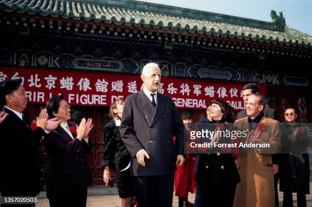 View of French singer Mirielle Mathieu as, with unidentified others, she attends the unveiling of a wax figure in Ditan Park, Beijing, China,...