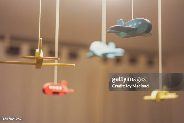 fly to dream - baby mobile stock pictures, royalty-free photos & images