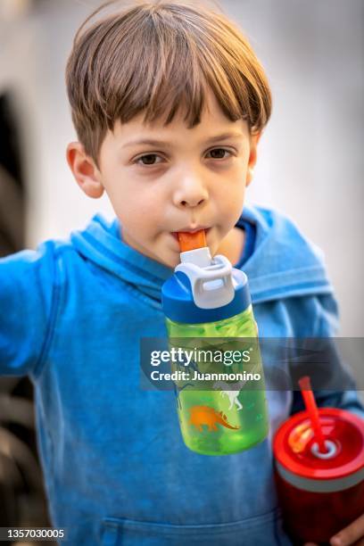 little boy drinking water - hoodie boy stock pictures, royalty-free photos & images