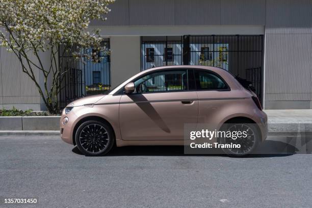 electric car fiat 500e cabrio on a street - fiat stockfoto's en -beelden