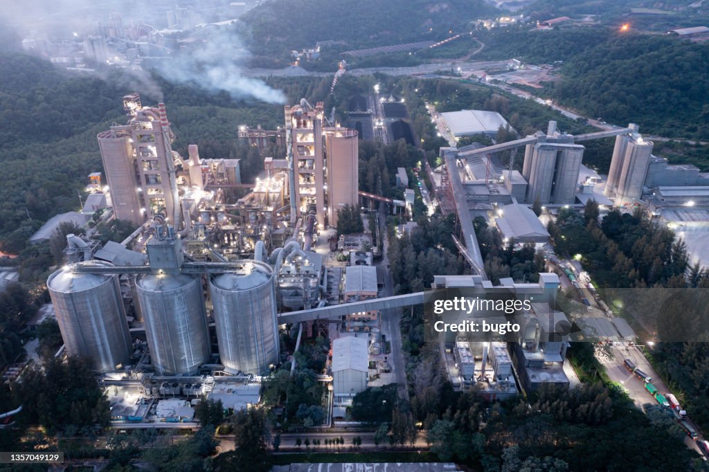 The cement plant manufacturing concrete in the evening