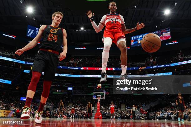 Daniel Gafford of the Washington Wizards celebrates after dunking in front of Lauri Markkanen of the Cleveland Cavaliers during the first half at...