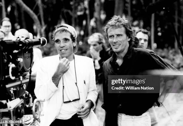 American filmmaker and director Abel Ferrara and American film and stage actor Peter Weller stand behind the scenes during the 1989 drama film "Cat...