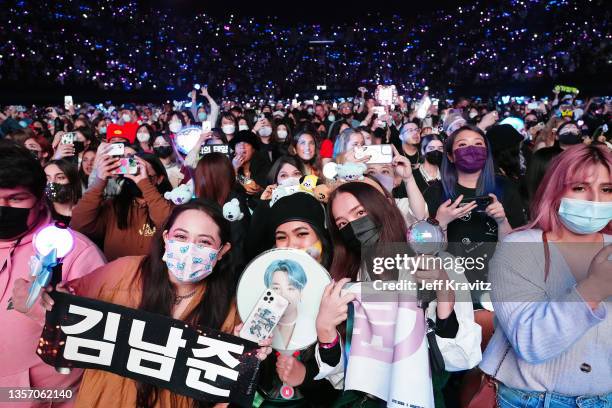 Concert-goers watch BTS perform onstage during iHeartRadio 102.7 KIIS FM's Jingle Ball 2021 presented by Capital One at The Forum on December 03,...