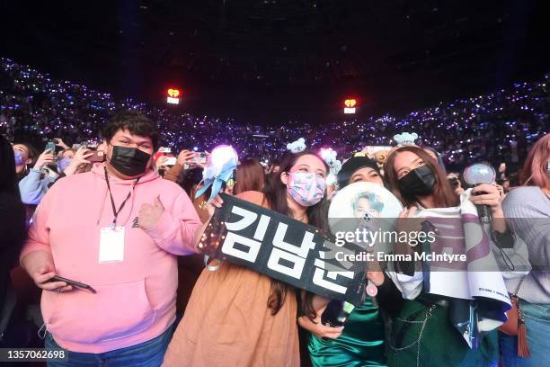 Concert-goers watch BTS perform onstage during iHeartRadio 102.7 KIIS FM's Jingle Ball 2021 presented by Capital One at The Forum on December 03,...