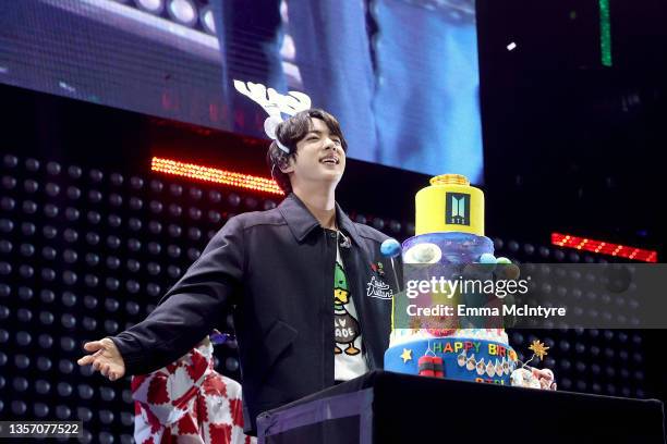 Sings "Happy Birthday" to Jin as they perform onstage during iHeartRadio 102.7 KIIS FM's Jingle Ball 2021 presented by Capital One at The Forum on...