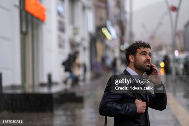 Grumpy Manager Getting Rained On Angry Businessman In Rain Photos and Premium High Res Pictures - Getty ...