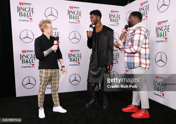 JoJo Wright, Lil Nas X, and EJ speak backstage during iHeartRadio 102.7 KIIS FM's Jingle Ball 2021 presented by Capital One at The Forum on December...