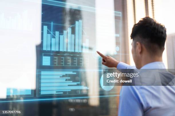 young man with smart vr screen in city street - hologram city stock pictures, royalty-free photos & images