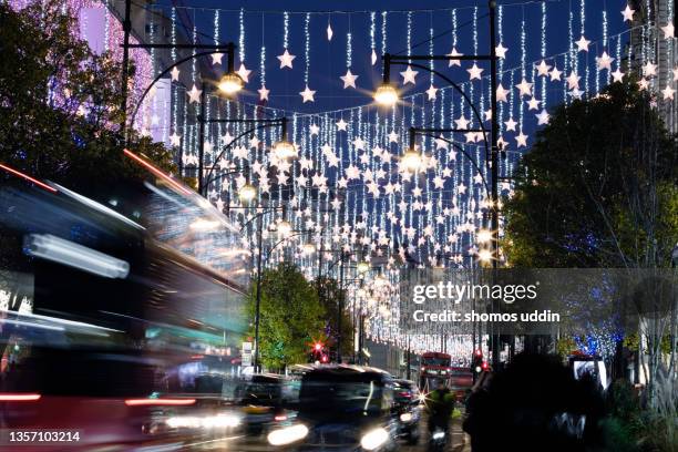 london oxford street at dusk during christmas season - oxford street shopping stock pictures, royalty-free photos & images