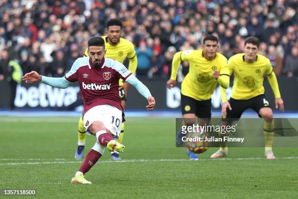 Manuel Lanzini of West Ham United scores their team's first goal from the penalty spot during the Premier League match between West Ham United and...