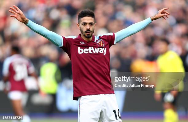 Manuel Lanzini of West Ham United celebrates after scoring their team's first goal from the penalty spot during the Premier League match between West...