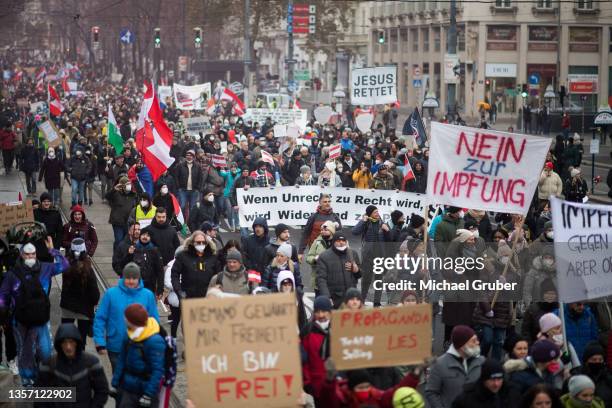 People protesting against lockdown measures and Covid vaccinations march through the city center during the fourth wave of the novel coronavirus...