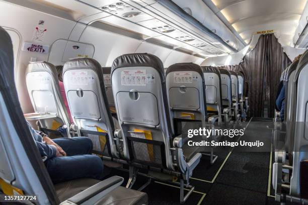 airplane aisle - airplane seat back stock pictures, royalty-free photos & images