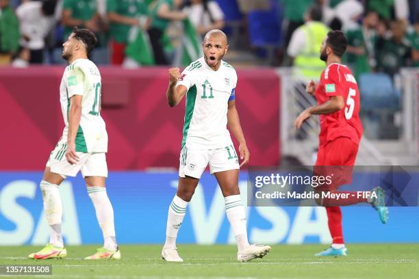 Yacine Brahimi of Algeria celebrates after scoring their team's first goal during the FIFA Arab Cup Qatar 2021 Group D match between Lebanon and...