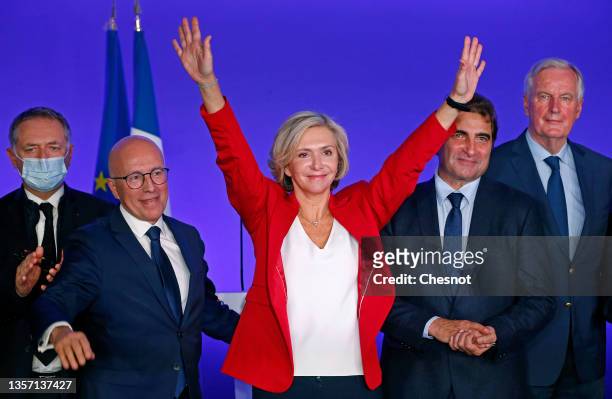 Les Republicains right-wing party's head of the Ile-de-France region and candidate for the 2022 presidential election Valerie Pecresse waves next to...