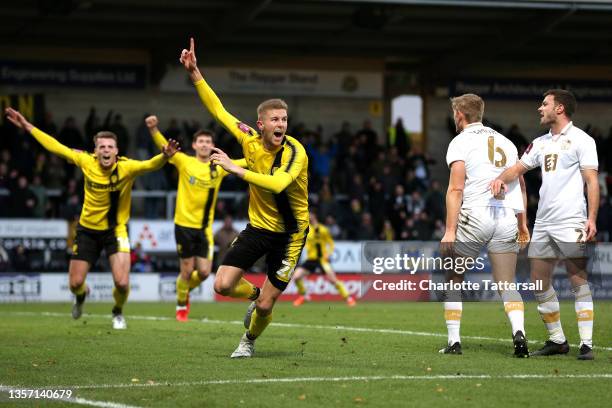 Ryan Leak of Burton Albion celebrates after scoring their sides first goal during the Emirates FA Cup Second Round match between Burton Albion and...