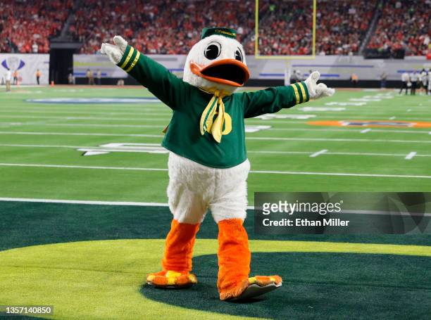 The Oregon Ducks mascot The Duck walks in an end zone during the Pac-12 Conference championship game between the Ducks and the Utah Utes at Allegiant...