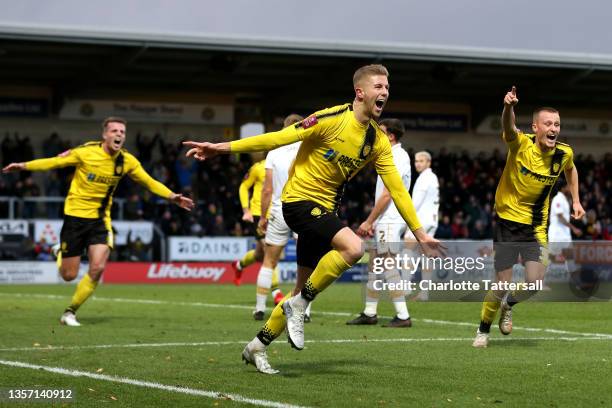 Ryan Leak of Burton Albion celebrates after scoring their sides first goal during the Emirates FA Cup Second Round match between Burton Albion and...