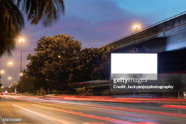 blank billboard on city street. outdoor advertising - horizontal billboard stock pictures, royalty-free photos & images