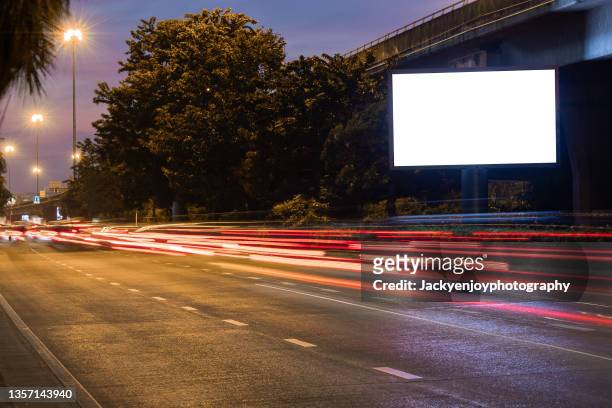 blank billboard on city street. outdoor advertising - billboard poster stock pictures, royalty-free photos & images