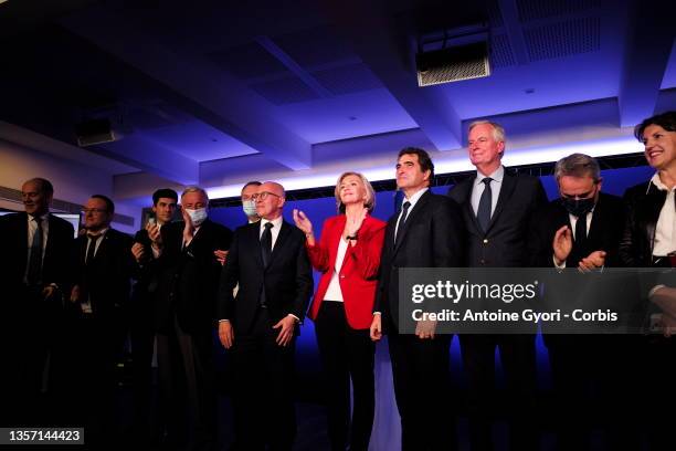 Les Republicains right-wing party's head of the Ile-de-France region and candidate for the 2022 presidential election Valerie Pecresse waves next to...