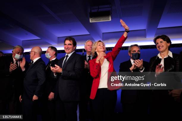 Les Republicains right-wing party's head of the Ile-de-France region and candidate for the 2022 presidential election Valerie Pecresse waves next to...