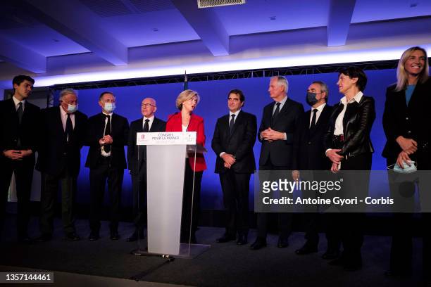 Les Republicains right-wing party's head of the Ile-de-France region and candidate for the 2022 presidential election Valerie Pecresse waves next to...