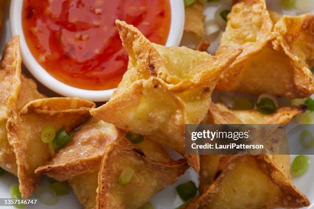 crispy crab rangoons - fried dough stock pictures, royalty-free photos & images