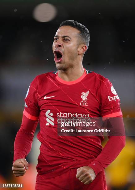 Thiago Alcantara of Liverpool celebrates their side's victory after the Premier League match between Wolverhampton Wanderers and Liverpool at...