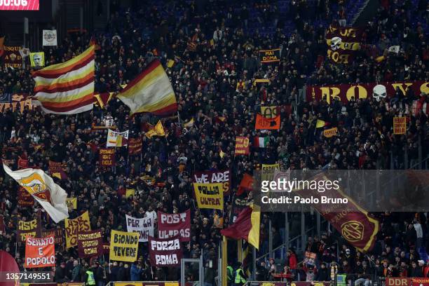 View of AS Roma fans holding up banners and flags inside the stadium during the Serie A match between AS Roma v FC Internazionale at Stadio Olimpico...